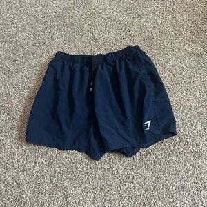 GYMSHARK 5 inch arrival shirts - LARGE